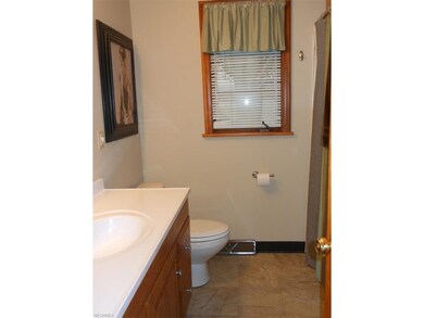 Updated 1st floor bathroom with tub and shower sur