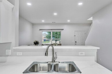 Kitchen with sink and Quartz stone countertops