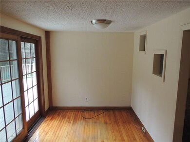 Area off kitchen could be an office...