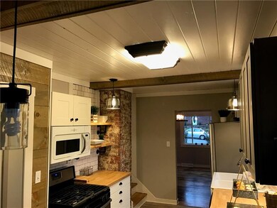 Kitchen 3 with exposed brick pillar!