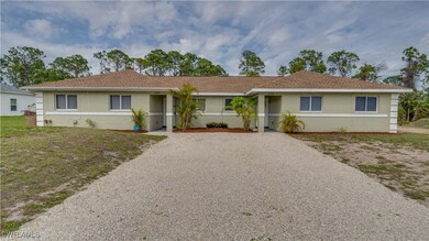 Single story home featuring stucco siding and grav