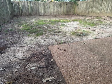 View of fenced backyard