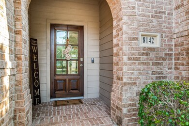 Covered front patio. Cement board exterior. Brick pavers on the front porch.