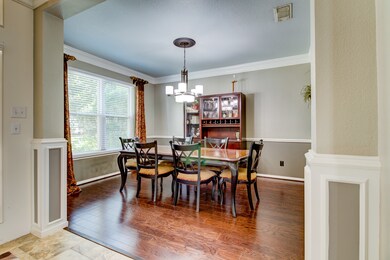 Light and bright dining room featuring upgraded wo