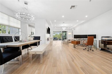 Dining area with light wood-type flooring and a ch