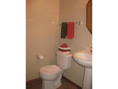 Main floor half bath with pedestal sink.