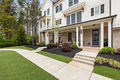 View of front of house featuring a front lawn, bri