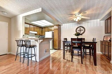 View of dining area, breakfast bar & kitchen.