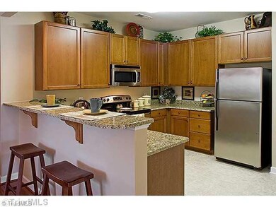 Kitchen. This photo is a representative and not the home listed. Available in November!