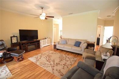 Great room...volume ceilings, crown molding, ceili
