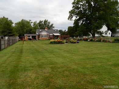 Exterior Back. Deep fenced yard with lots of beaut