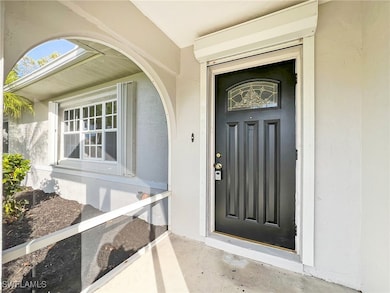 Doorway to property with stucco siding