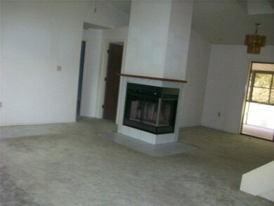 Living room with fireplace, cathedral ceilings