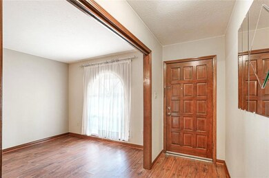 Foyer with entry into the formal dining room