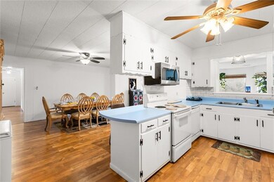 Kitchen featuring white electric range oven, white