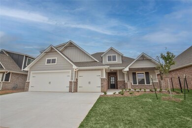 Craftsman-style home featuring a garage and a front yard