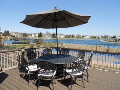 Tiered deck leads to pool, yard and lake. Morning 