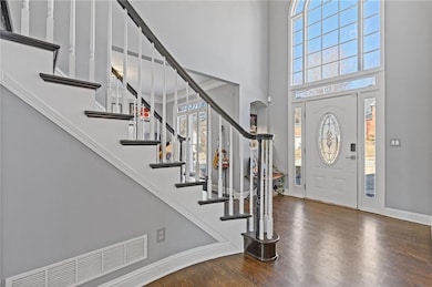 Foyer featuring dark hardwood / wood-style floorin