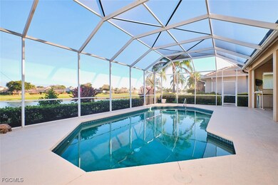 Swimming pool with a sunroom, a lanai, and a patio