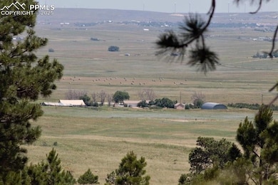 Property view of mountains with a rural view