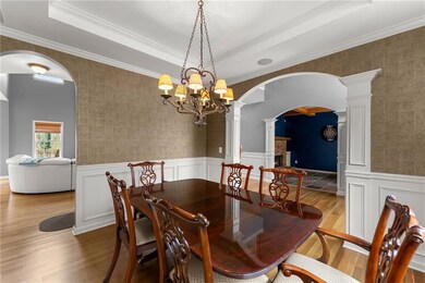 Dining space with ornate columns, wood finished fl
