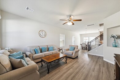 The cozy living room offers an open, inviting spac