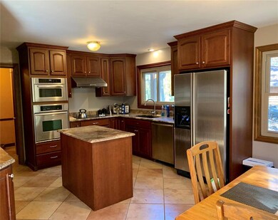 Eat-in kitchen has beautiful granite, back hallway