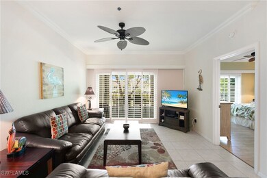 Living room with ceiling fan, crown molding, light