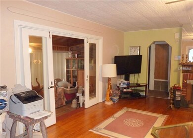 Florida Room with ceramic tile flooring & French d