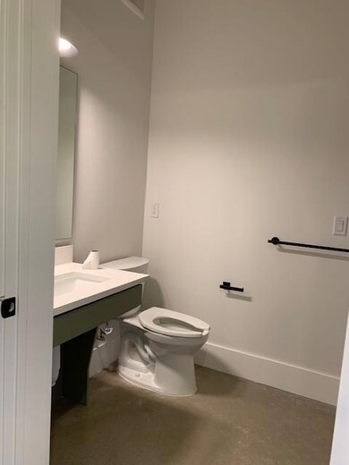 Bathroom featuring concrete floors and vanity