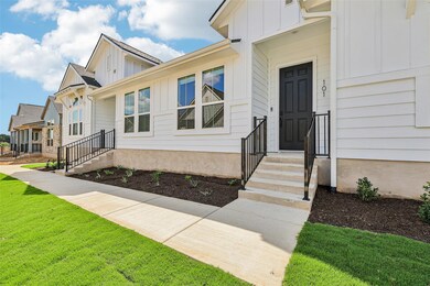 Doorway to property with board and batten siding 