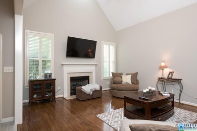 Boasts soaring ceilings, gleaming hardwoods, reces