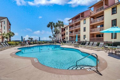 View of pool with fence and a patio