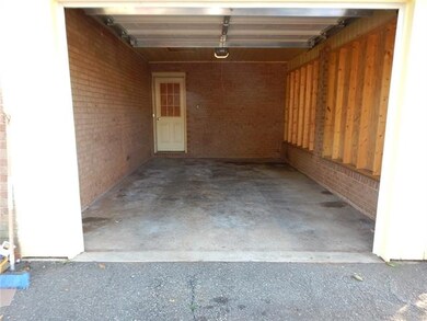 Single car garage. Door leads into mudroom/laundry