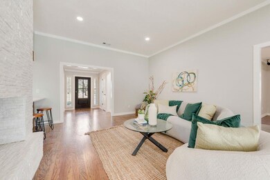 Living room featuring recessed lighting, crown mol