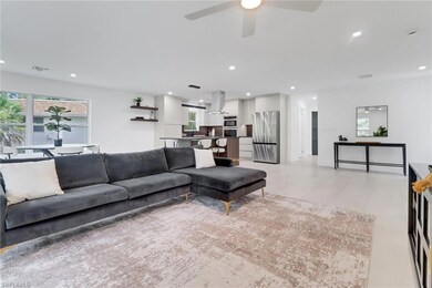 Living area with ceiling fan, recessed lighting, v