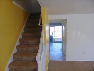 Stairs to Bedrooms and hallway to dining area and 