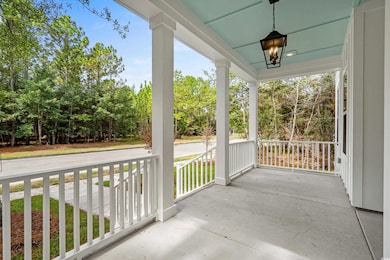 Porch featuring view of scattered trees