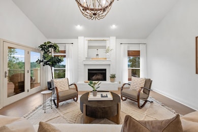 Living area featuring vaulted ceiling, wood finis