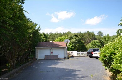 Here is a detached 2 car garage.  There is also an attached one car garage at the rear of the property. Large driveway with plenty of parking.