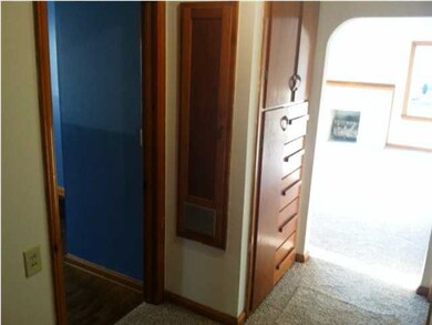 Hallway veiw with built in ironing board.