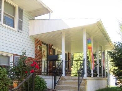 Covered front porch with railings