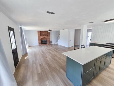 Kitchen with light hardwood / wood-style floors, s
