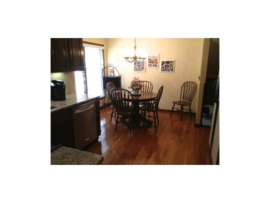 Bright, Eat-in Kitchen with Gleaming Hardwood Floo