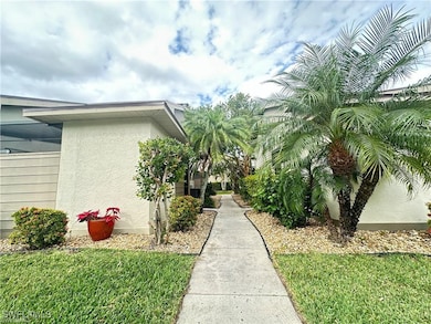 View of property exterior with a lawn