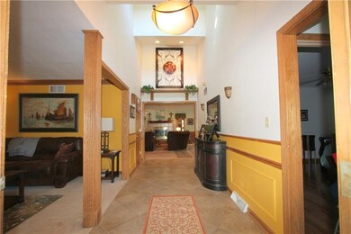 Grand entry way that looks into the main living ar