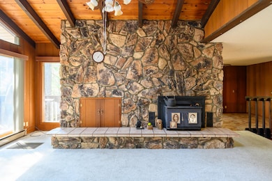 floor to ceiling stone fireplace