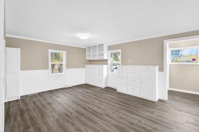 #6 - Dining Room with Built Ins & Entry Way from Living Room.jpg