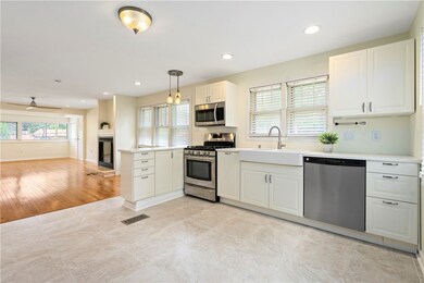 New kitchen with stainless appliances and quartz c
