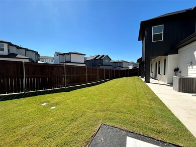 View of yard with central AC unit and a patio